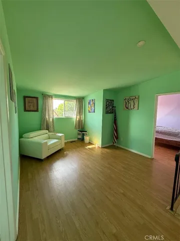 a bedroom with a bed and a window in it