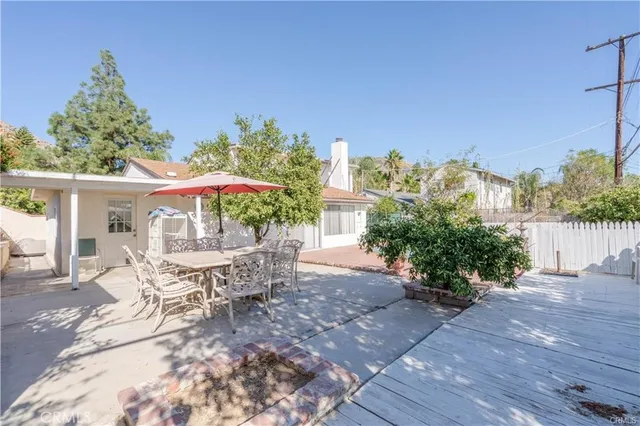 a view of a fountain in middle of a yard
