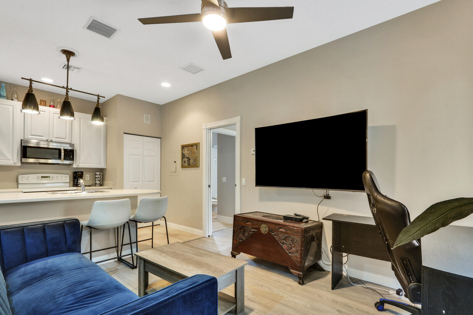 101 St Pierre Way Jupiter, FL 33458 - Photo 36 of 57 a living room with furniture and a flat screen tv