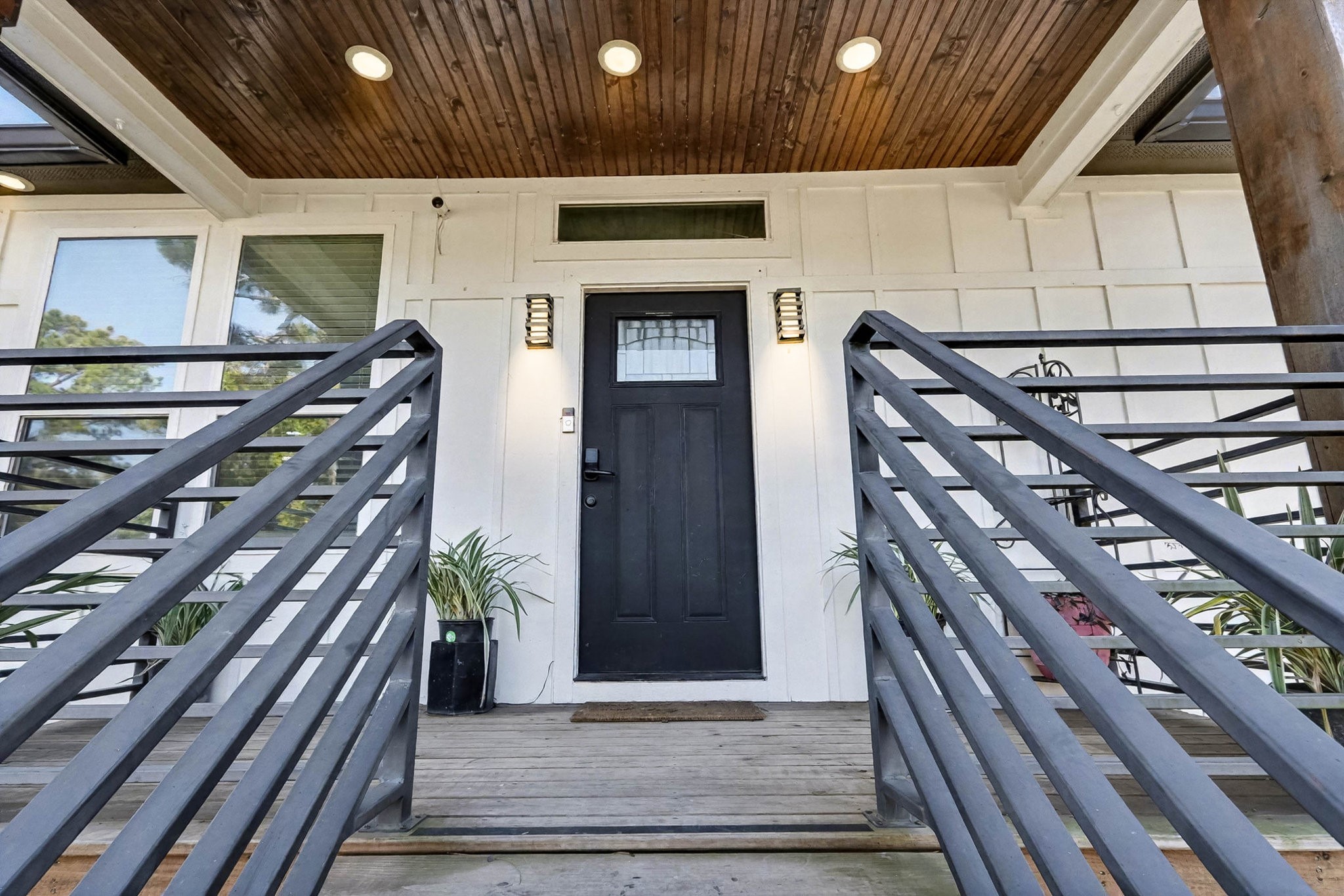 a view of an entryway with wooden floor