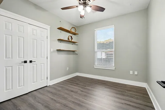 a kitchen with granite countertop cabinets stainless steel appliances and a sink