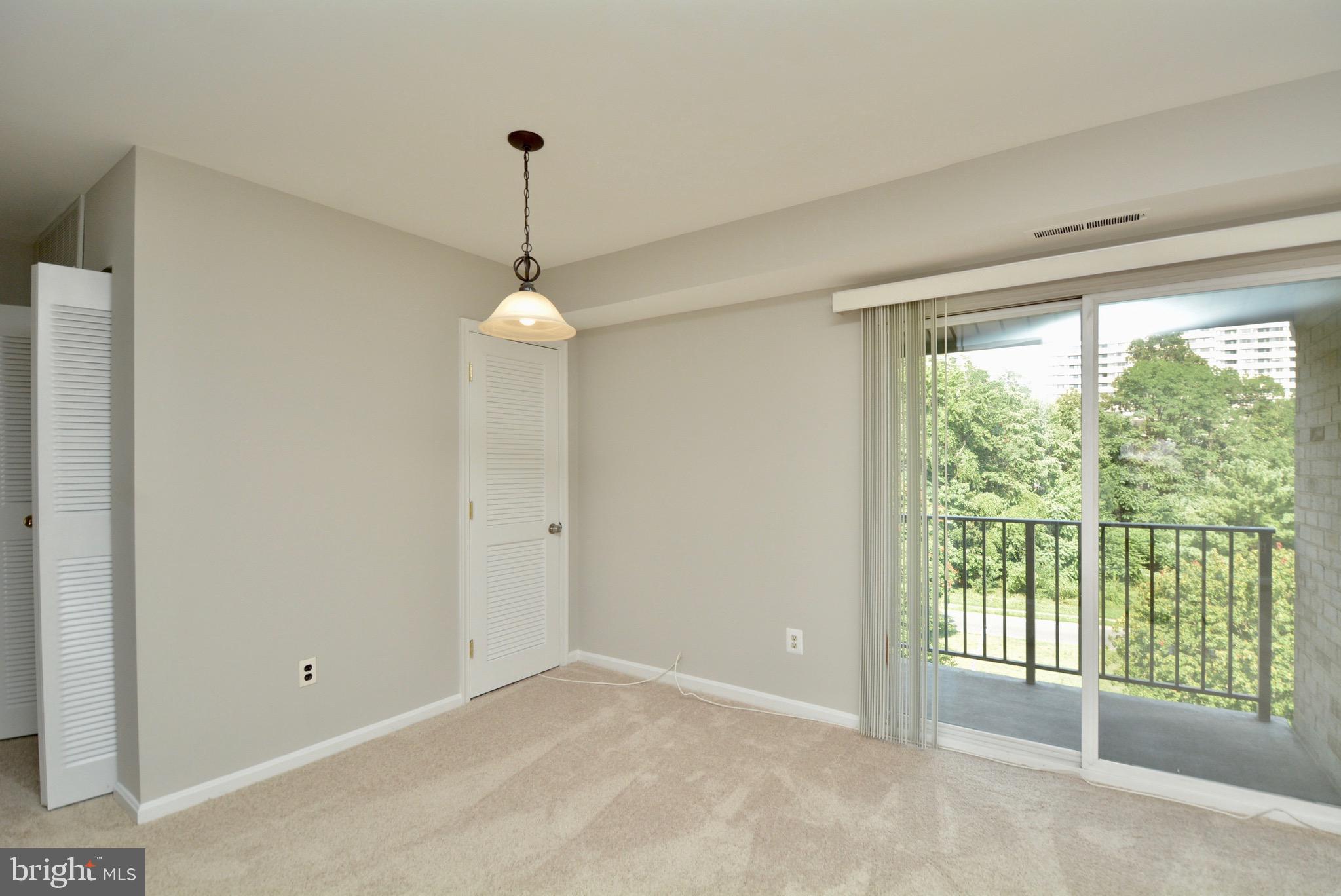 6139 Edsall Road, Unit M Alexandria, VA 22304 - Photo 8 of 24 Formal dining room space with balcony