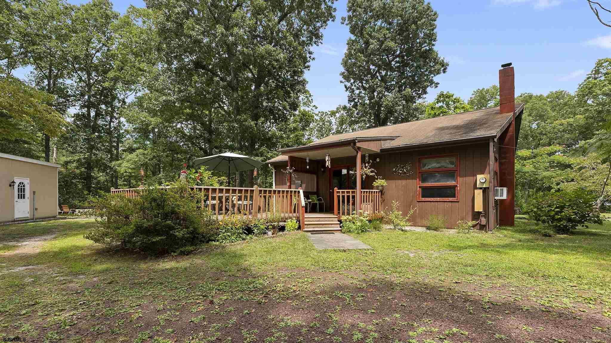 26 Indian Walk Road Ocean View, NJ 08230 - Photo 2 of 27 a front view of a house with a yard