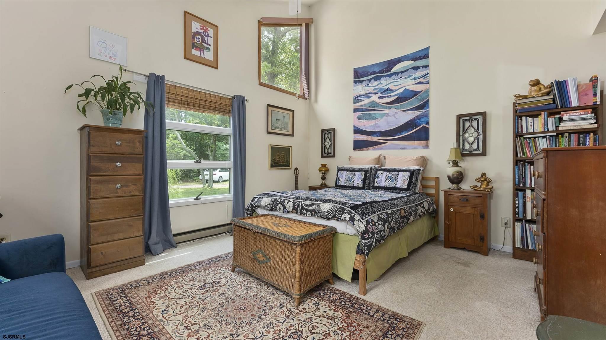 26 Indian Walk Road Ocean View, NJ 08230 - Photo 12 of 27 a spacious bedroom with a bed and a dresser