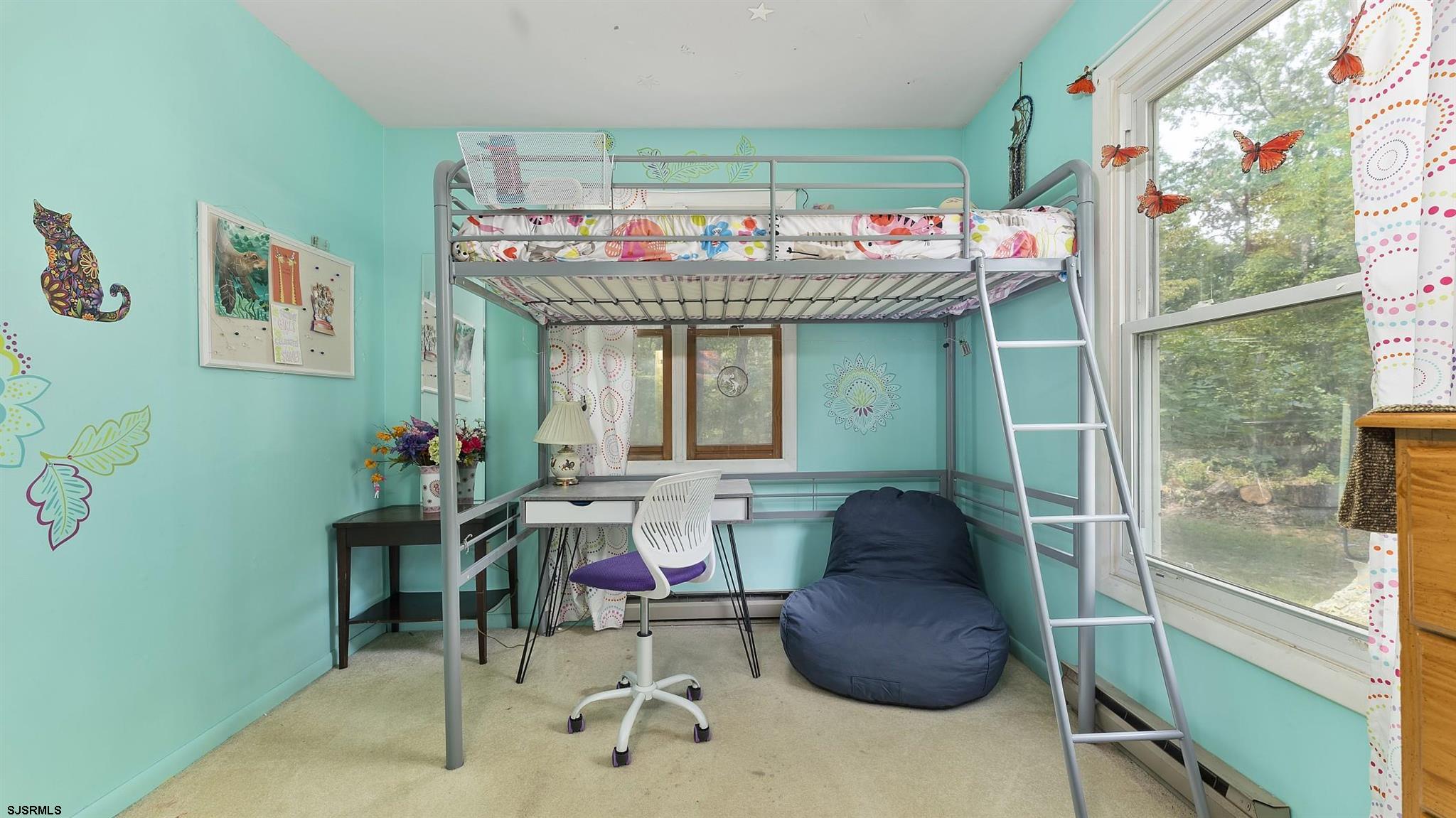 26 Indian Walk Road Ocean View, NJ 08230 - Photo 15 of 27 a room with furniture and a chandelier