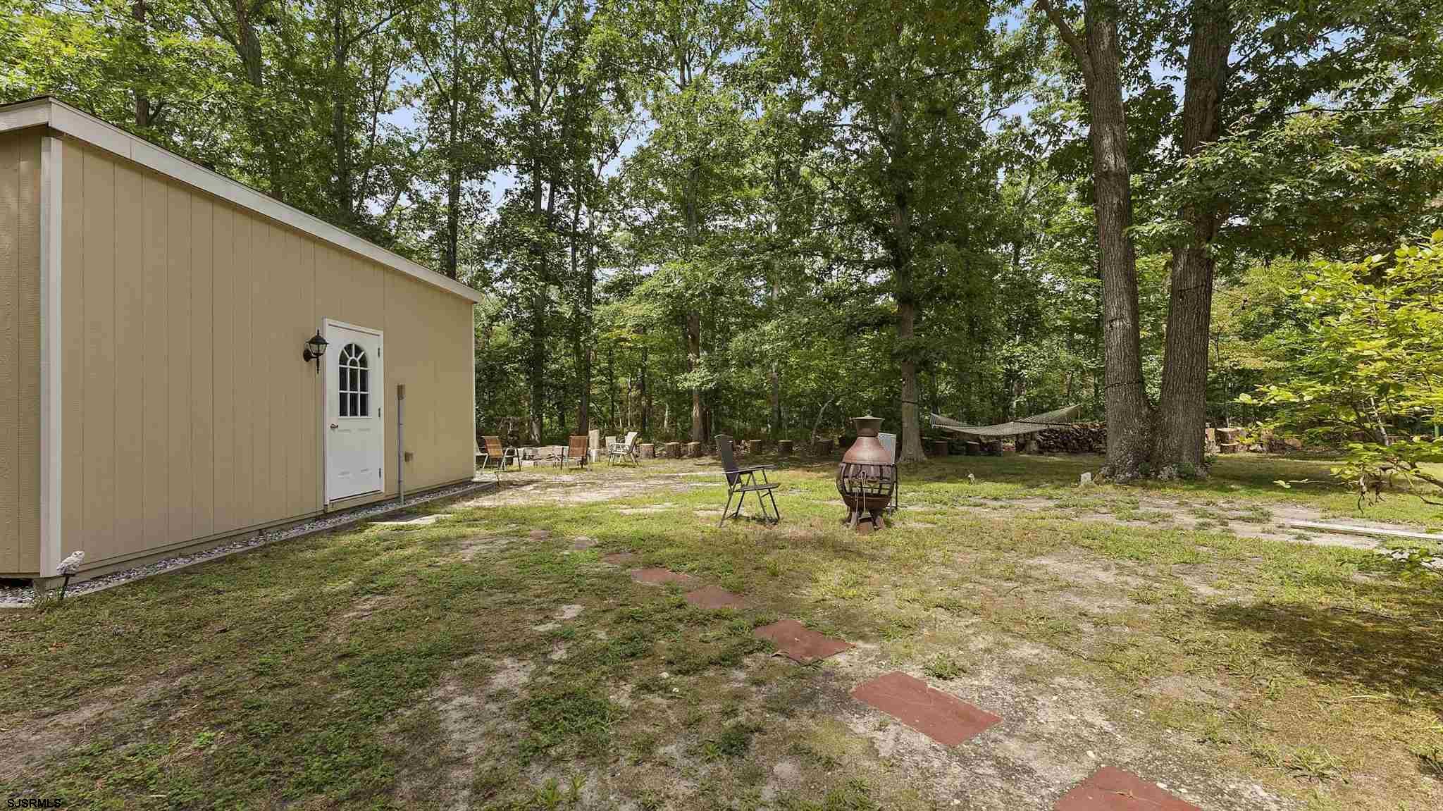 26 Indian Walk Road Ocean View, NJ 08230 - Photo 21 of 27 a backyard of a house with entertaining space