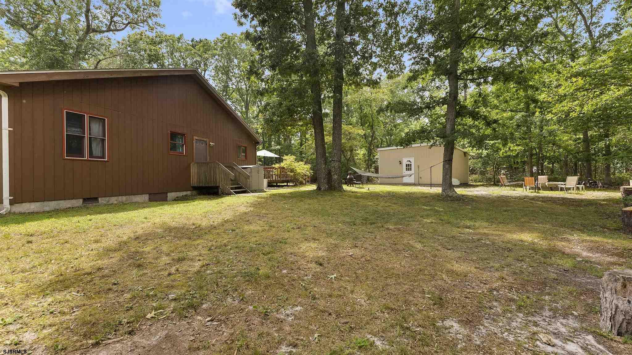 26 Indian Walk Road Ocean View, NJ 08230 - Photo 25 of 27 a house with trees in the background