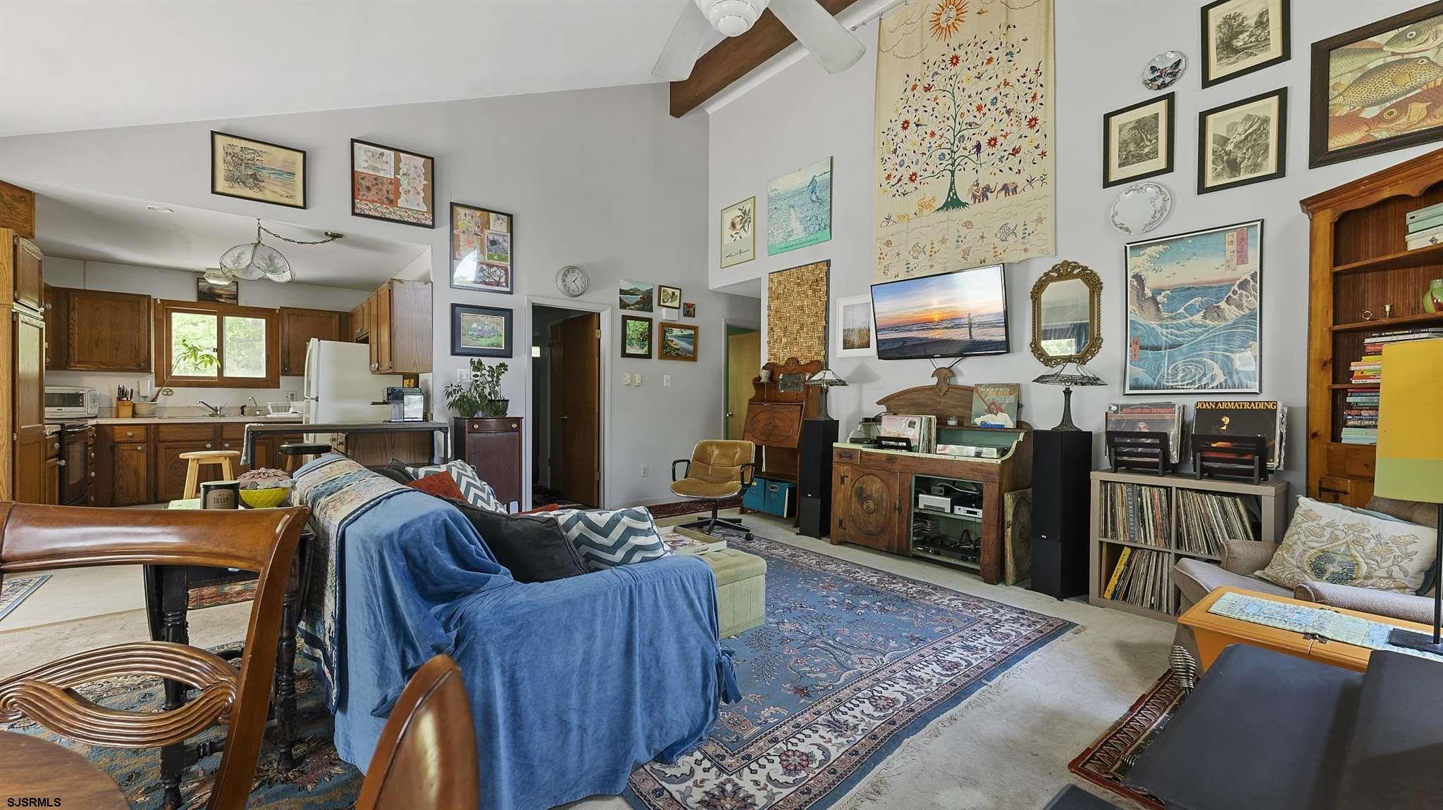 26 Indian Walk Road Ocean View, NJ 08230 - Photo 7 of 27 a living room with furniture and a kitchen view
