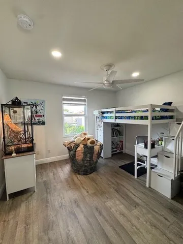 a room with furniture and a wooden floor