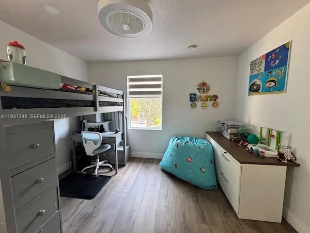 a bedroom with a bed and furniture