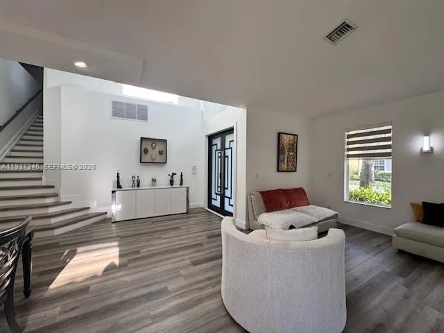 a living room with furniture and a window
