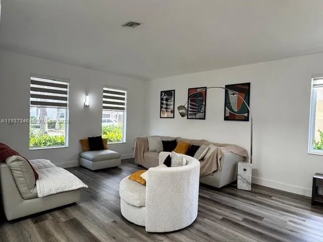 a living room with furniture and a window