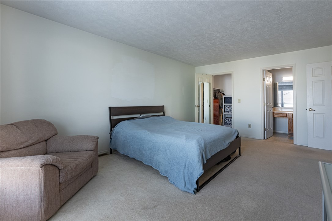 5399 Country Ridge Drive Mason, OH 45040 - Photo 20 of 29 This spacious bedroom offers ample comfort and convenience, with an adjoining closet and private bathroom access.
