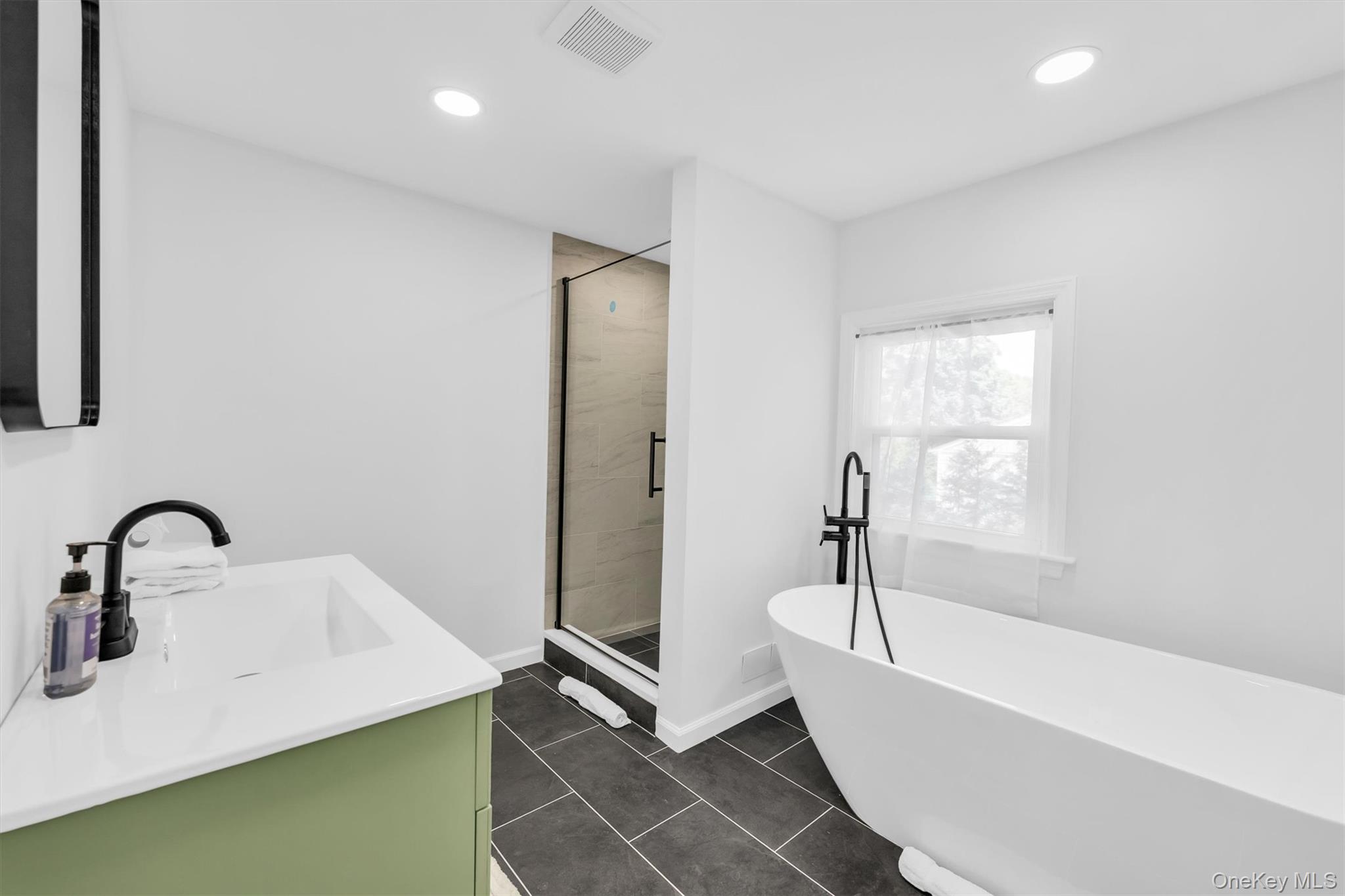 8 North Westbury Road Hampton Bays, NY 11946 - Photo 28 of 50 primary bathroom with stand free bathtub and shower