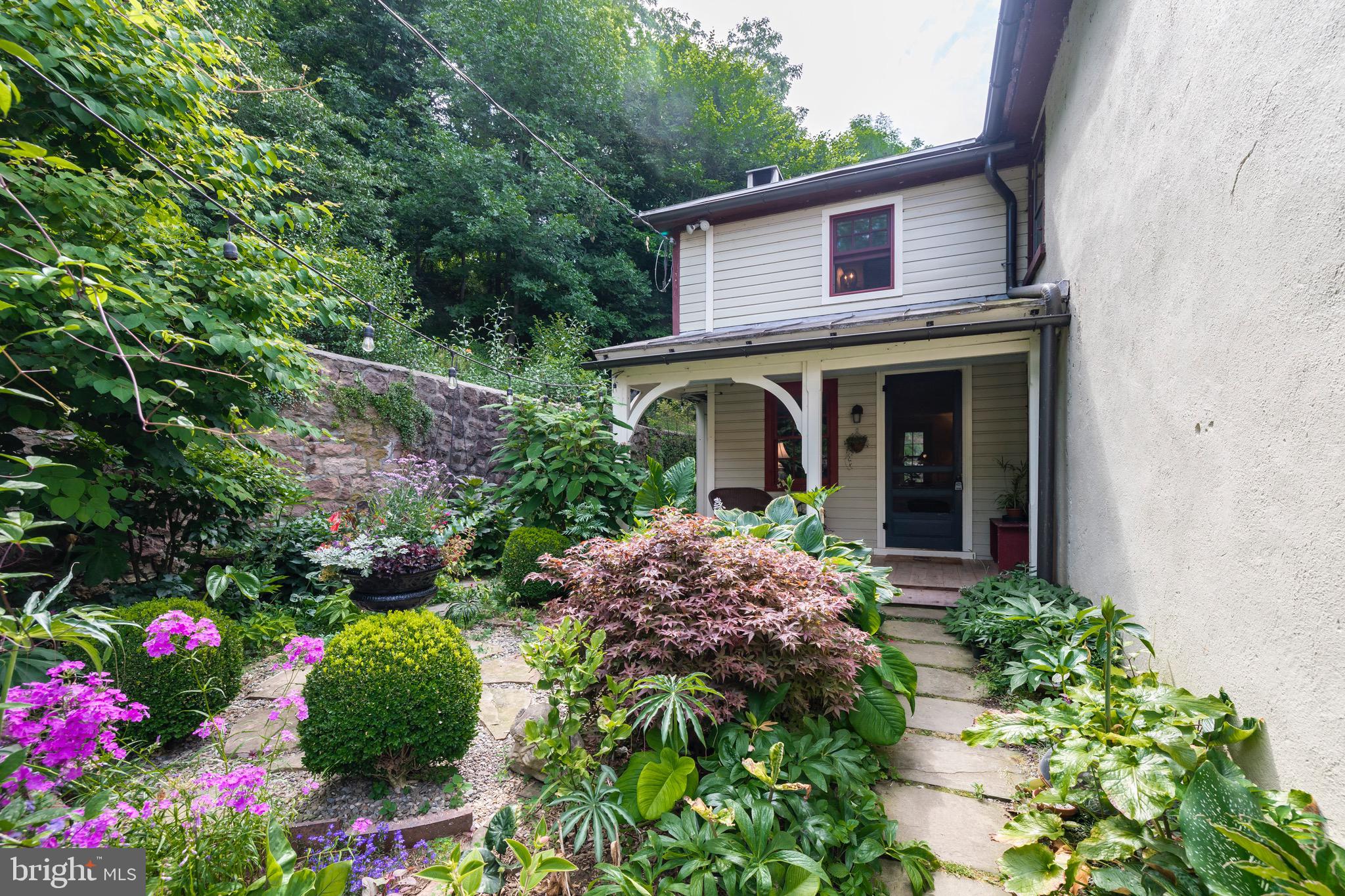 155 Mill Road Morgantown, PA 19543 - Photo 15 of 57 Beautiful gardens lead to charming porch