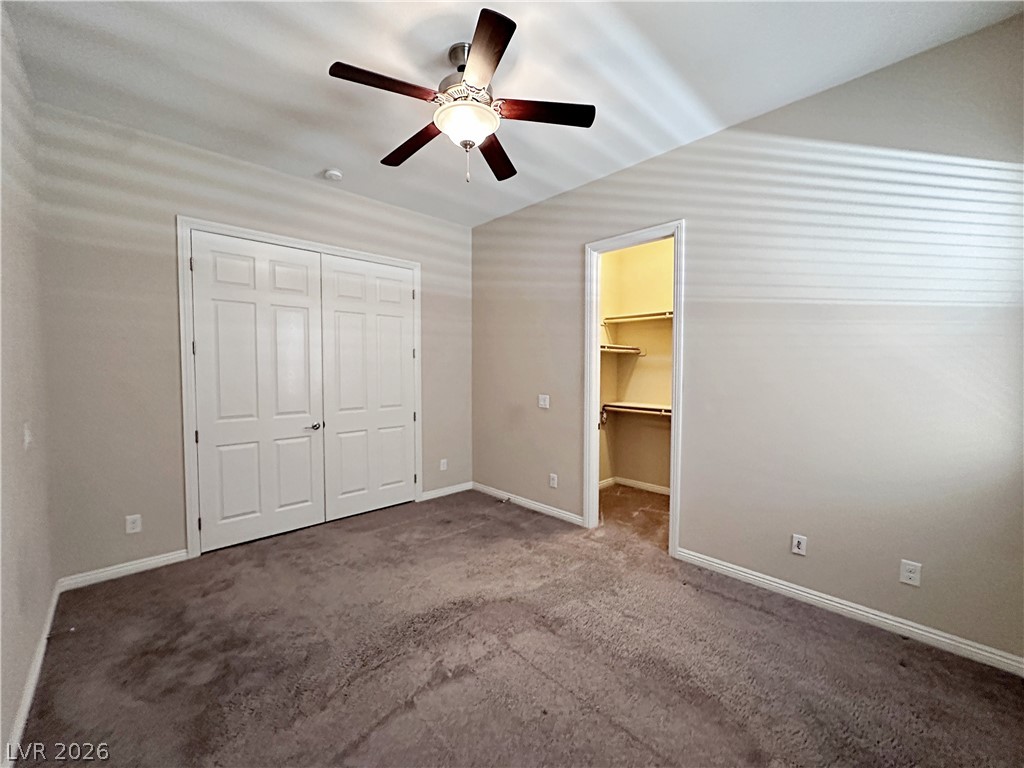 71 Newton Ridge Way Las Vegas, NV 89183 - Photo 24 of 40 A restful chamber with a practical walk-in closet awaits.