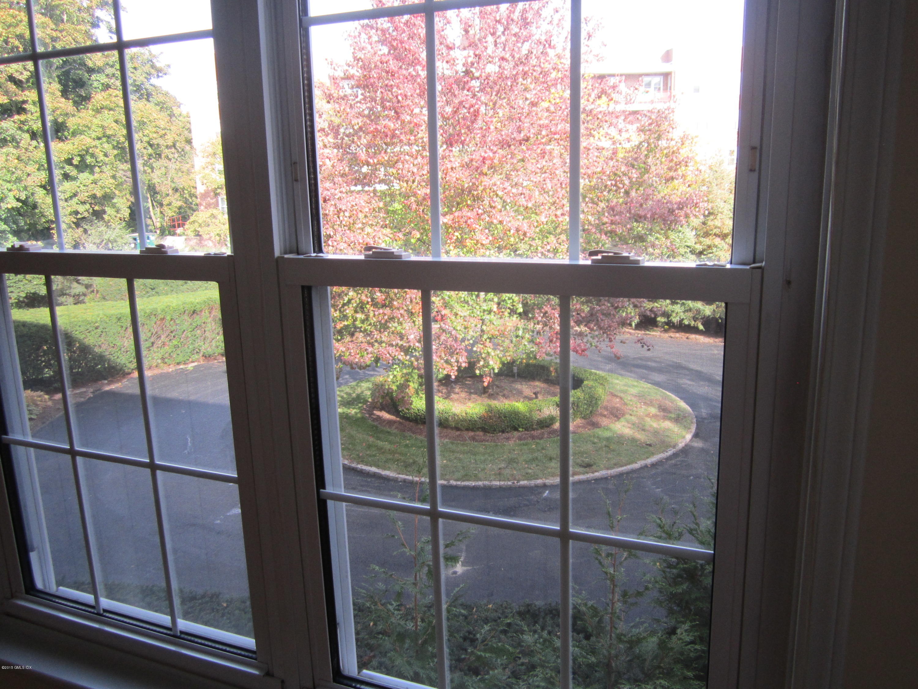 140 Field Point Road, Unit 21 Greenwich, CT 06830 - Photo 10 of 12 a bathroom with a glass door