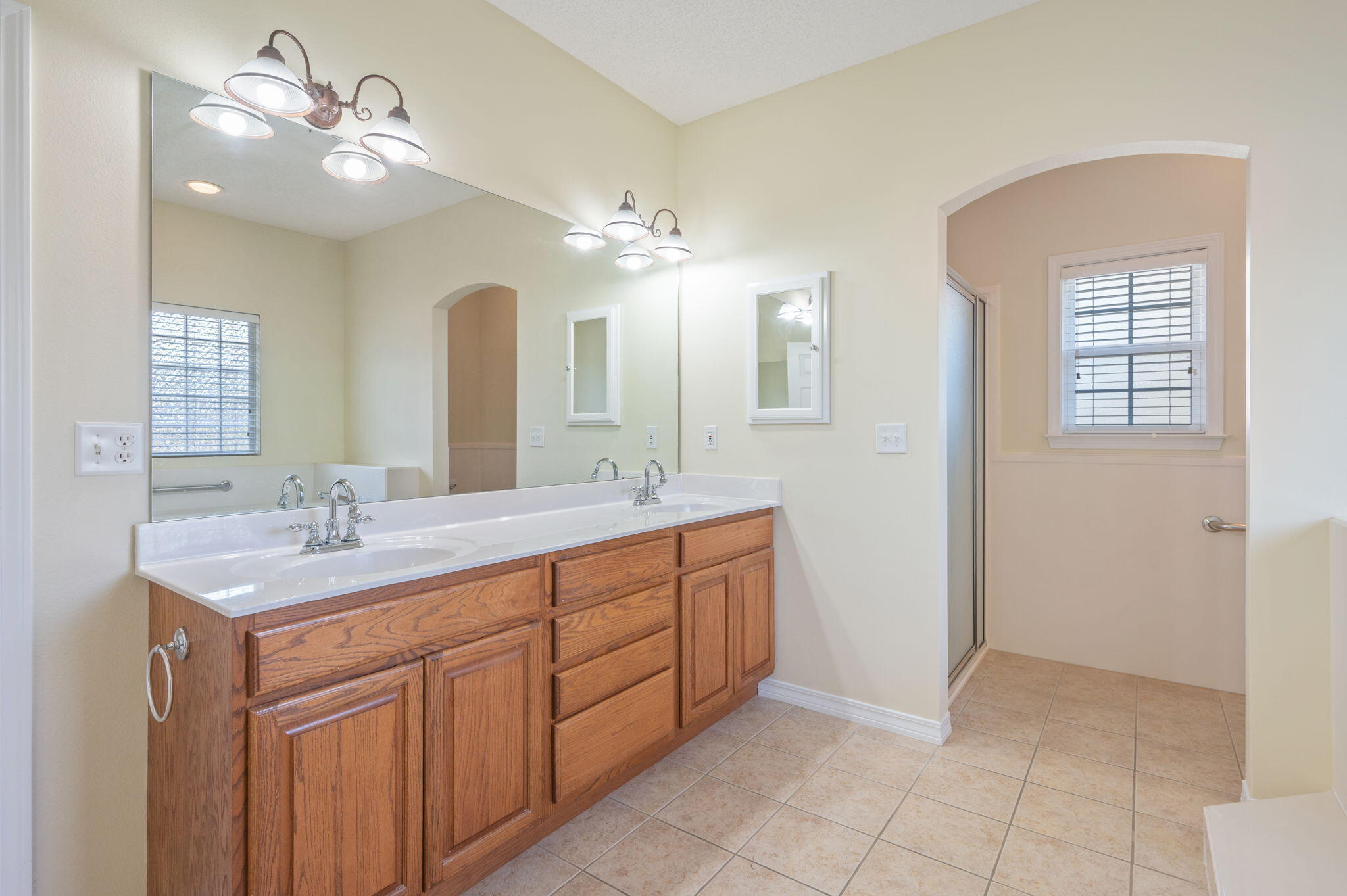 5552 Frontier Drive Crestview, FL 32536 - Photo 25 of 50 a bathroom with a double vanity sink and a mirror