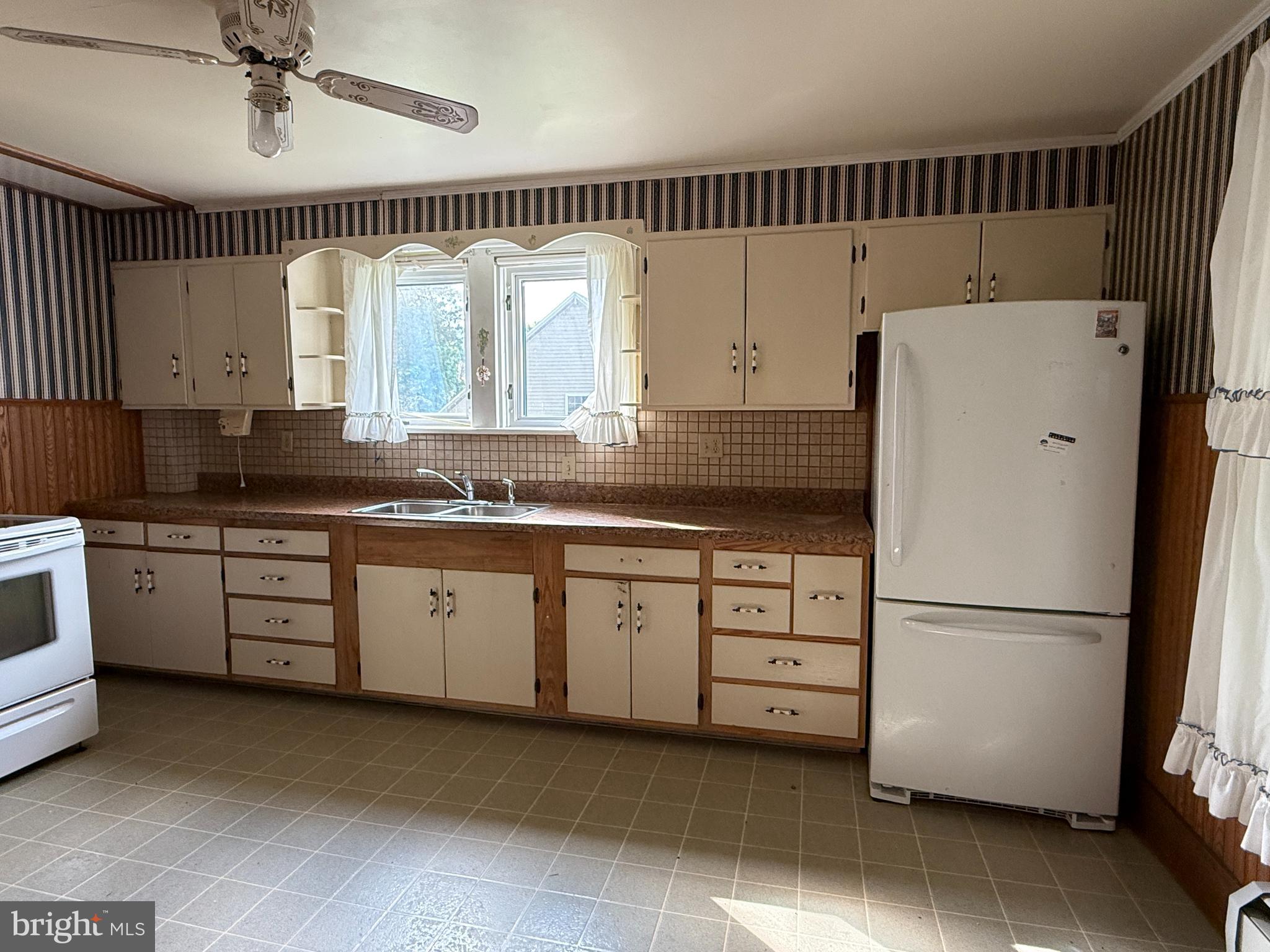 112 South Ridge Street Burnham, PA 17009 - Photo 10 of 33 a kitchen with a refrigerator and a sink