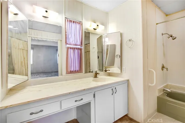 a kitchen with a sink and a refrigerator