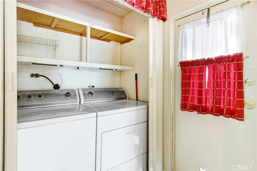 10210 Base Line Road, Unit 173 Rancho Cucamonga, CA 91701 - Photo 13 of 17 a kitchen with a sink and a refrigerator