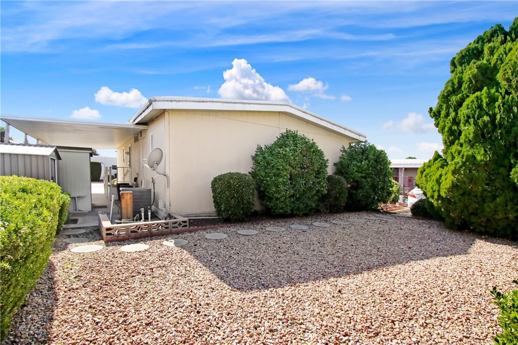 10210 Base Line Road, Unit 173 Rancho Cucamonga, CA 91701 - Photo 14 of 17 a front view of a house with garden