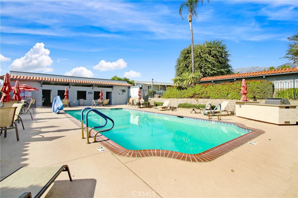 10210 Base Line Road, Unit 173 Rancho Cucamonga, CA 91701 - Photo 15 of 17 a view of a house with a swimming pool