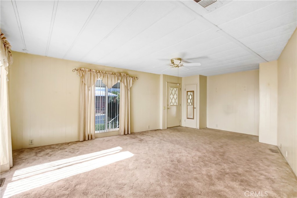 10210 Base Line Road, Unit 173 Rancho Cucamonga, CA 91701 - Photo 6 of 17 an empty room with a natural light