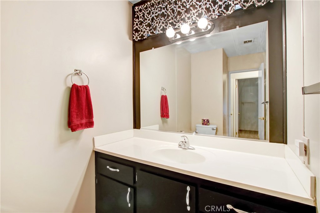 10210 Base Line Road, Unit 173 Rancho Cucamonga, CA 91701 - Photo 9 of 17 a bathroom with a sink and a mirror