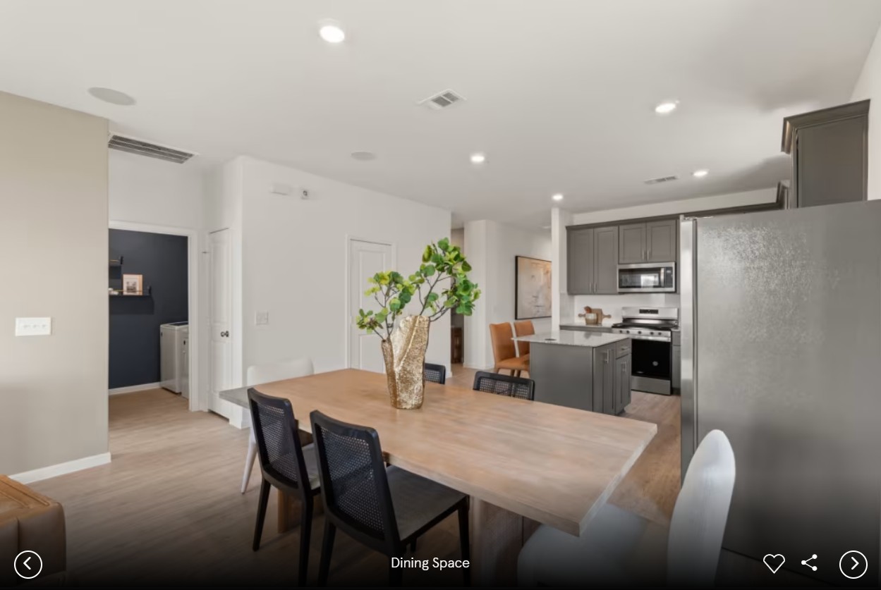 173 Golden Bell Way Buda, TX 78610 - Photo 7 of 7 a kitchen with a table and chairs in it