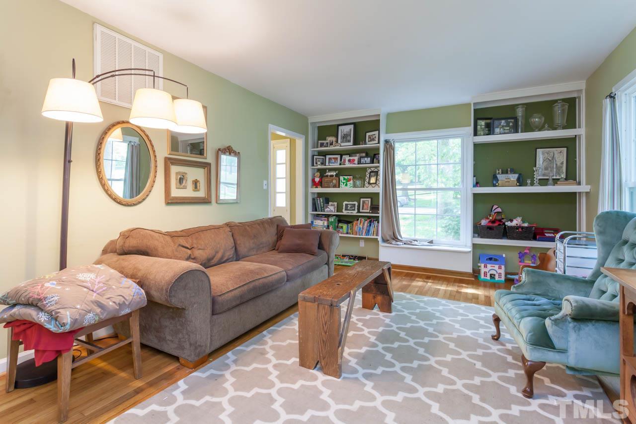 1733 Euclid Road Durham, NC 27713 - Photo 13 of 25 a living room with furniture a rug and a window