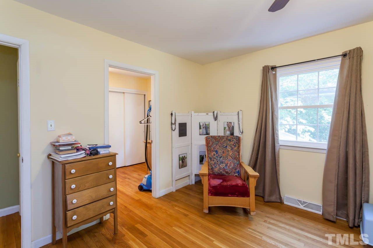 1733 Euclid Road Durham, NC 27713 - Photo 16 of 25 a living room with furniture and wooden floor