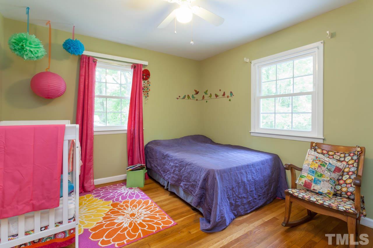 1733 Euclid Road Durham, NC 27713 - Photo 21 of 25 a bedroom with a bed and window