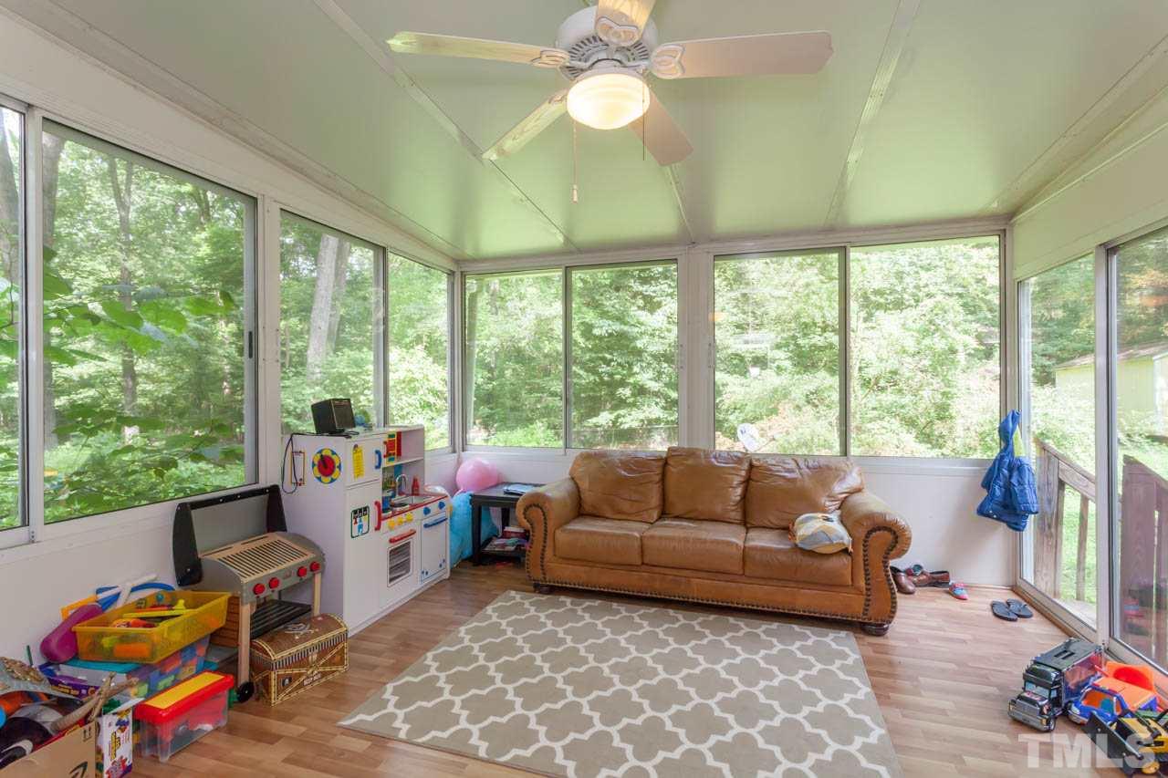 1733 Euclid Road Durham, NC 27713 - Photo 22 of 25 a living room with furniture and a large window