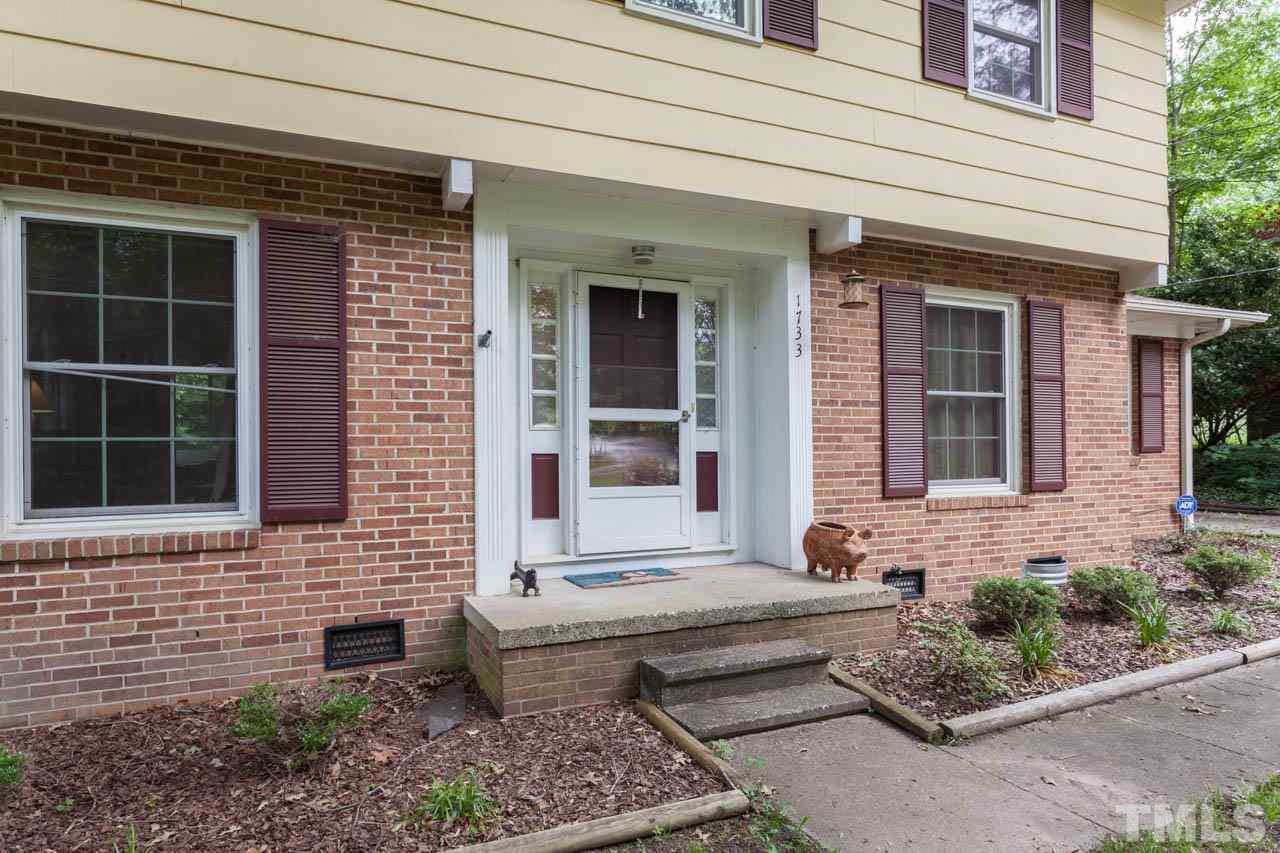 1733 Euclid Road Durham, NC 27713 - Photo 5 of 25 a front view of a house with a garden