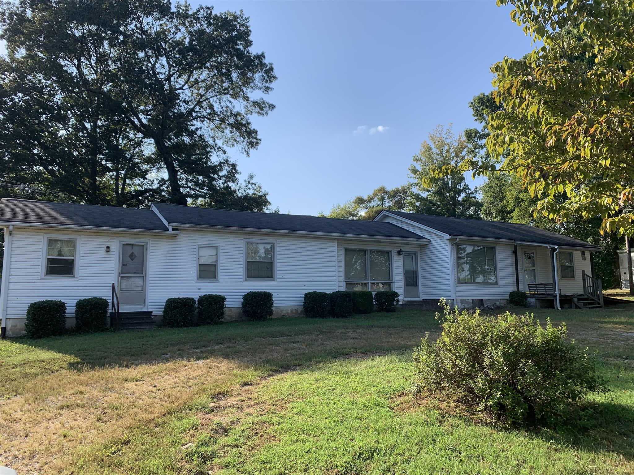 1303 Academy Road Portland, TN 37148 - Photo 1 of 30 a house view with a garden space
