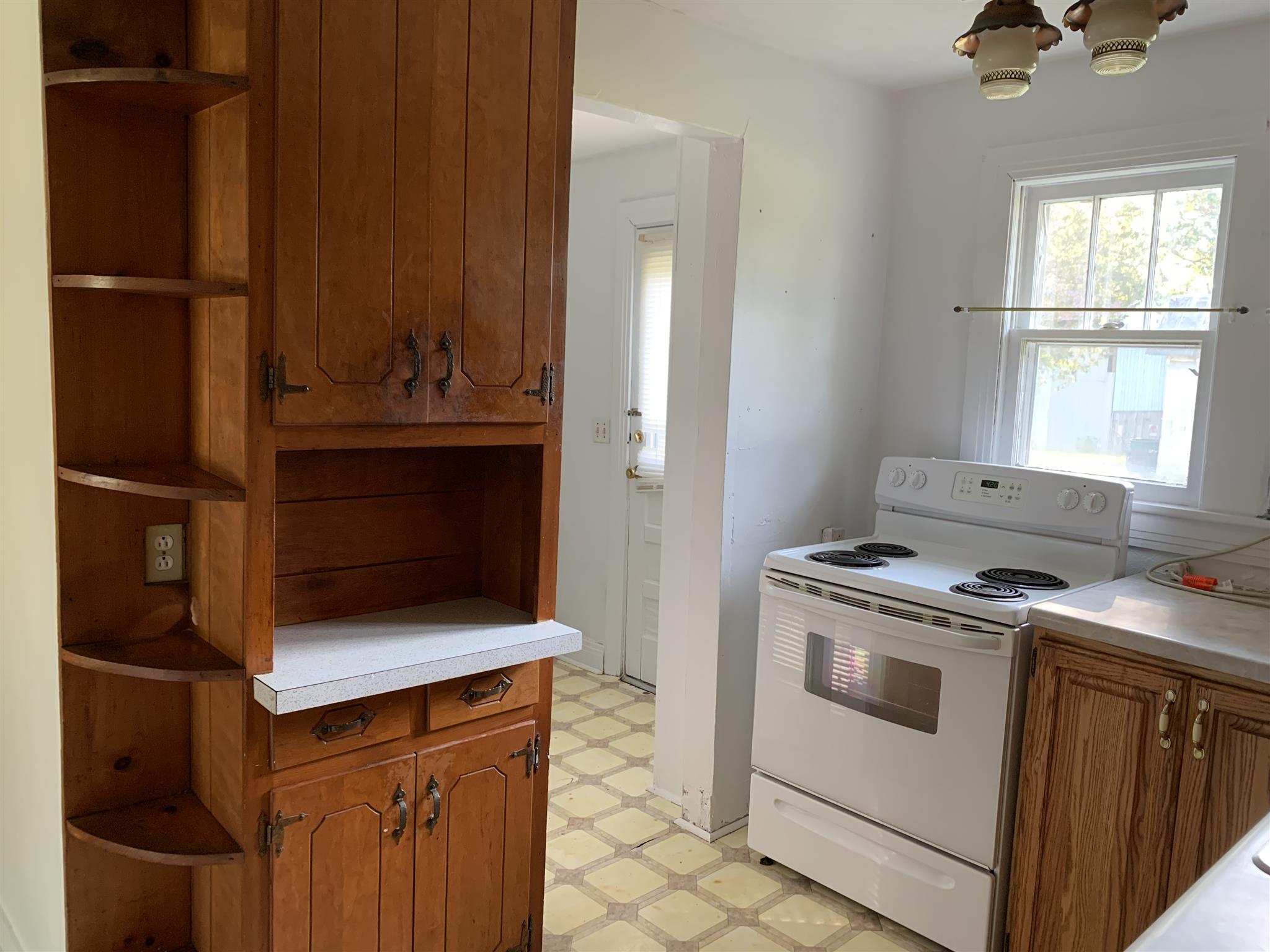 1303 Academy Road Portland, TN 37148 - Photo 20 of 30 a kitchen with a stove and a microwave