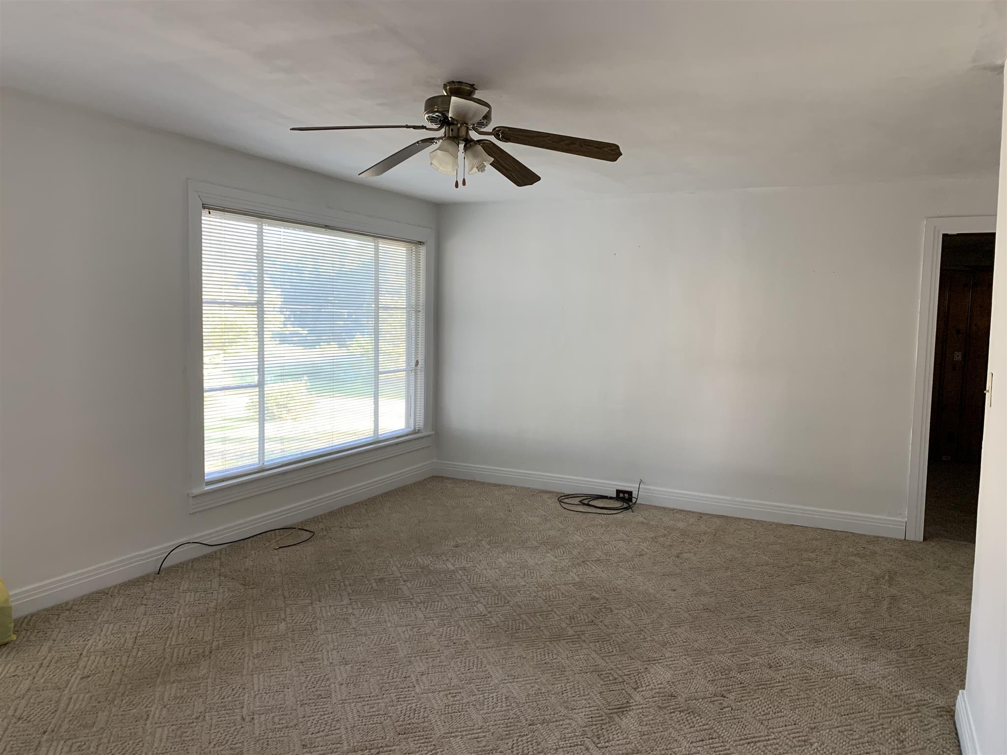 1303 Academy Road Portland, TN 37148 - Photo 6 of 30 an empty room with a window