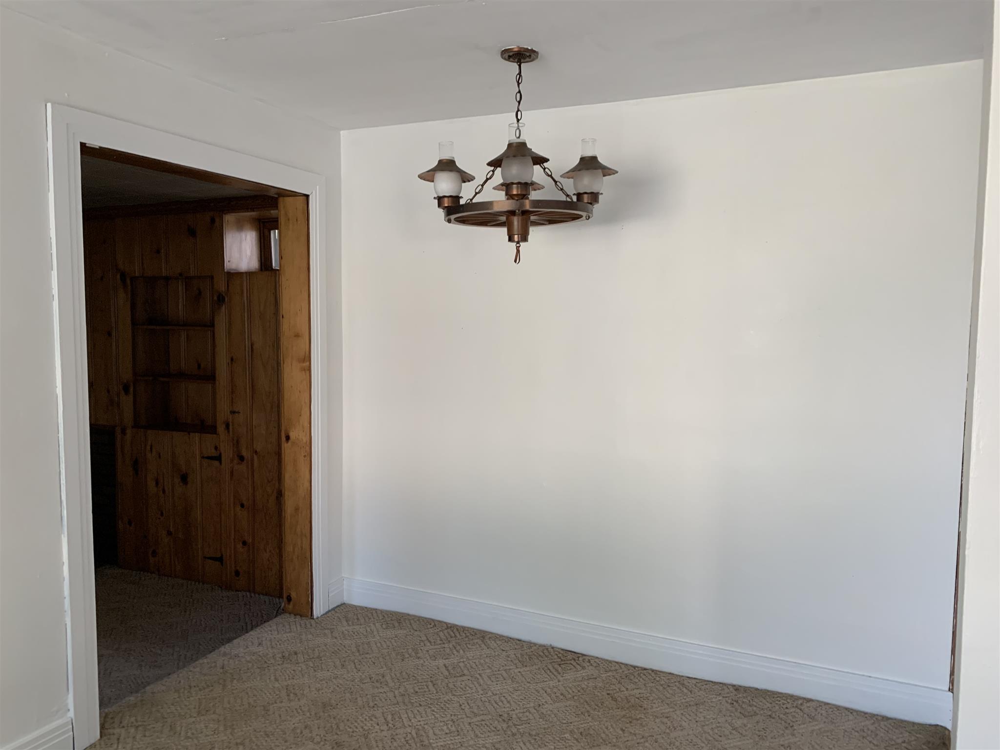 1303 Academy Road Portland, TN 37148 - Photo 8 of 30 an empty room with a door