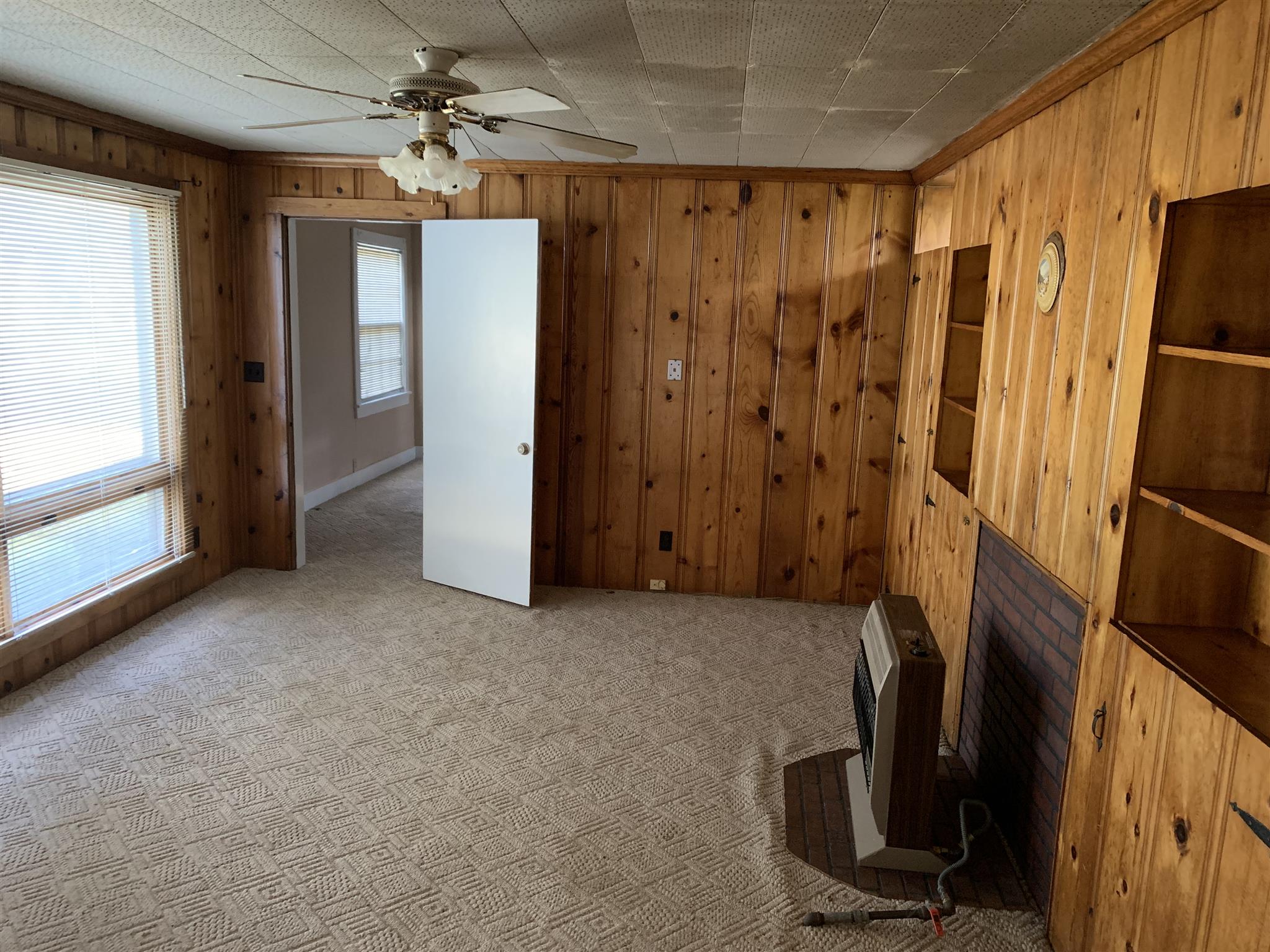 1303 Academy Road Portland, TN 37148 - Photo 9 of 30 a view of a hallway with a refrigerator