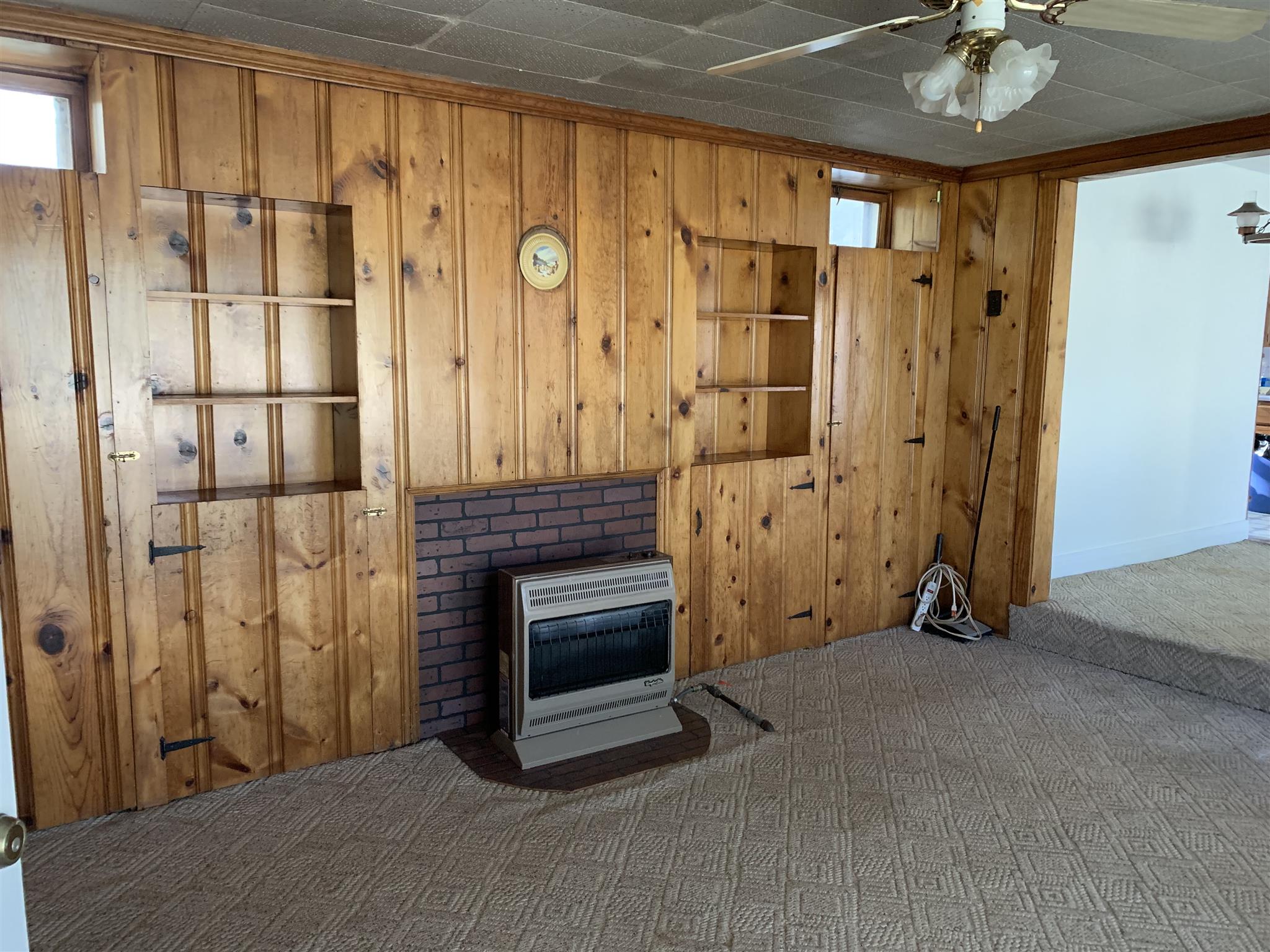 1303 Academy Road Portland, TN 37148 - Photo 10 of 30 a view of an empty room with a fireplace