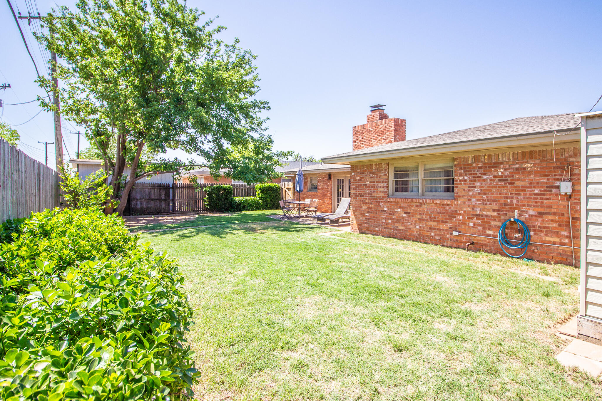 5219 9th Street Lubbock, TX 79416 - Photo 11 of 23 a front view of a house with garden
