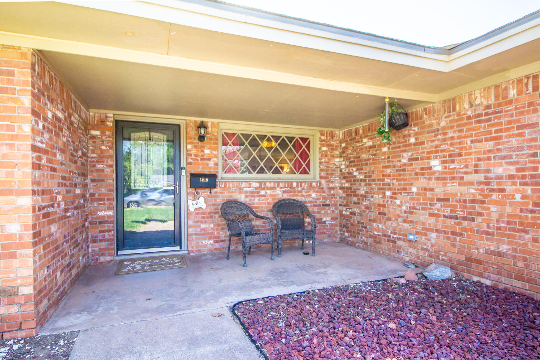 5219 9th Street Lubbock, TX 79416 - Photo 14 of 23 a living room with furniture and a rug