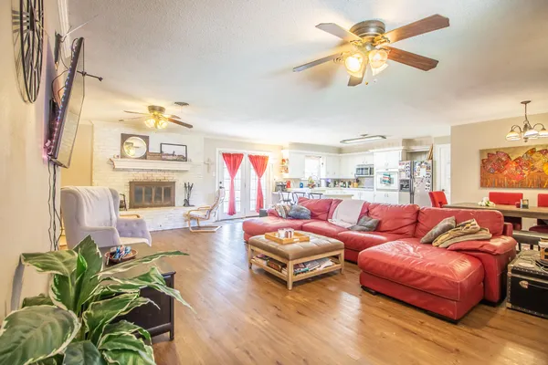 a living room with furniture and a large window