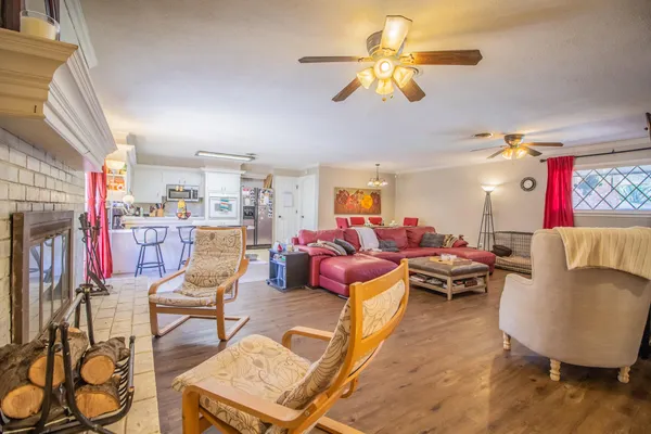 a living room with lots of furniture and a chandelier