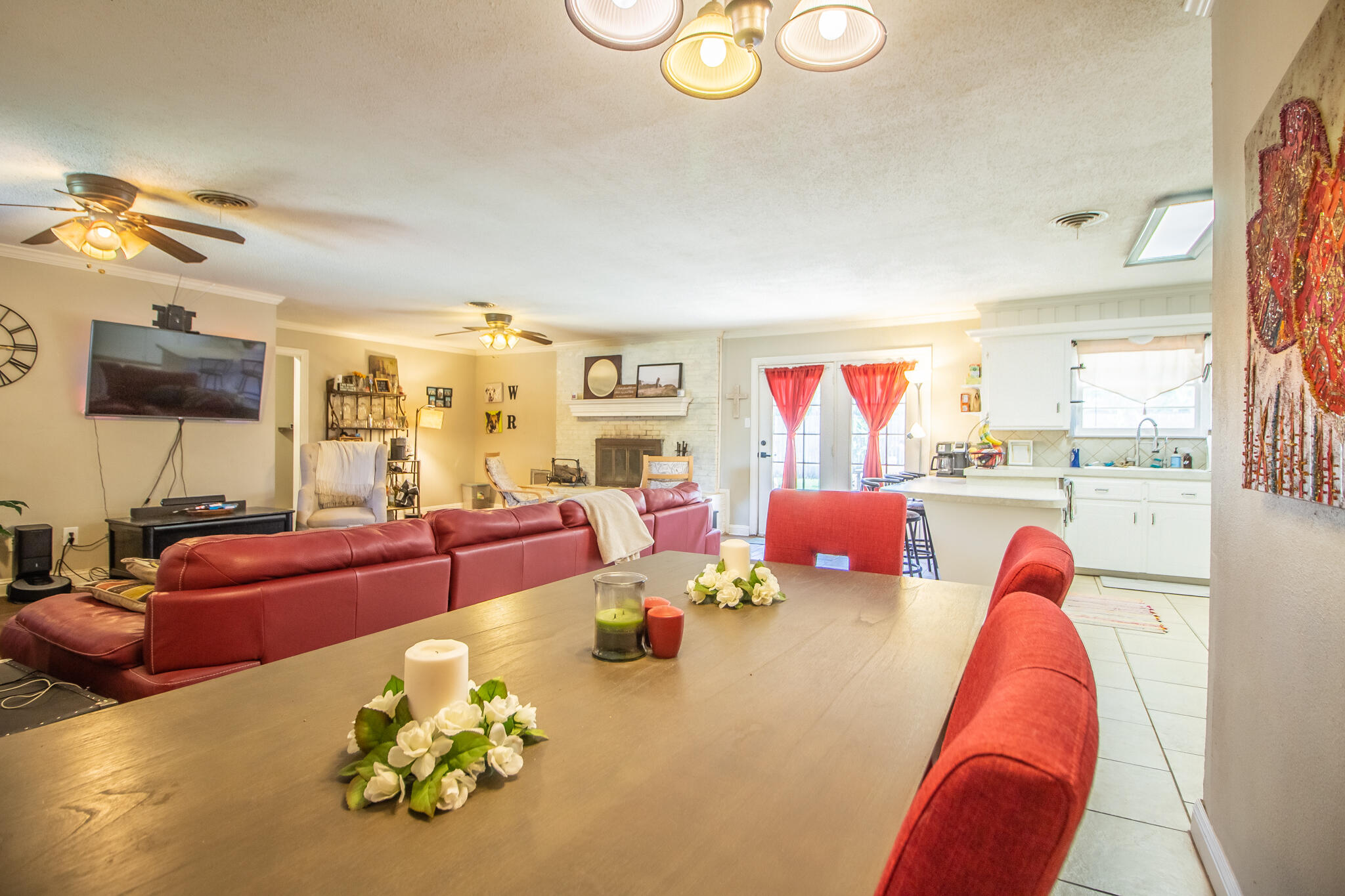 5219 9th Street Lubbock, TX 79416 - Photo 20 of 23 a living room with furniture and a flat screen tv