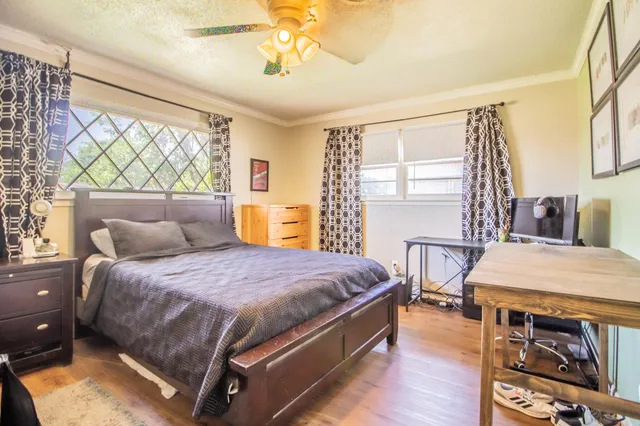 a bedroom with a bed and a table