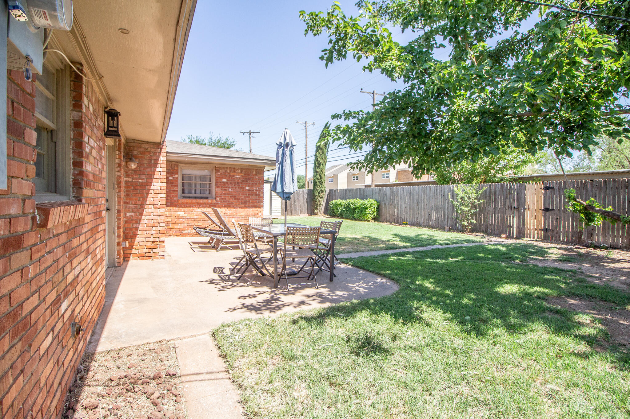 5219 9th Street Lubbock, TX 79416 - Photo 9 of 23 a view of a backyard with a patio
