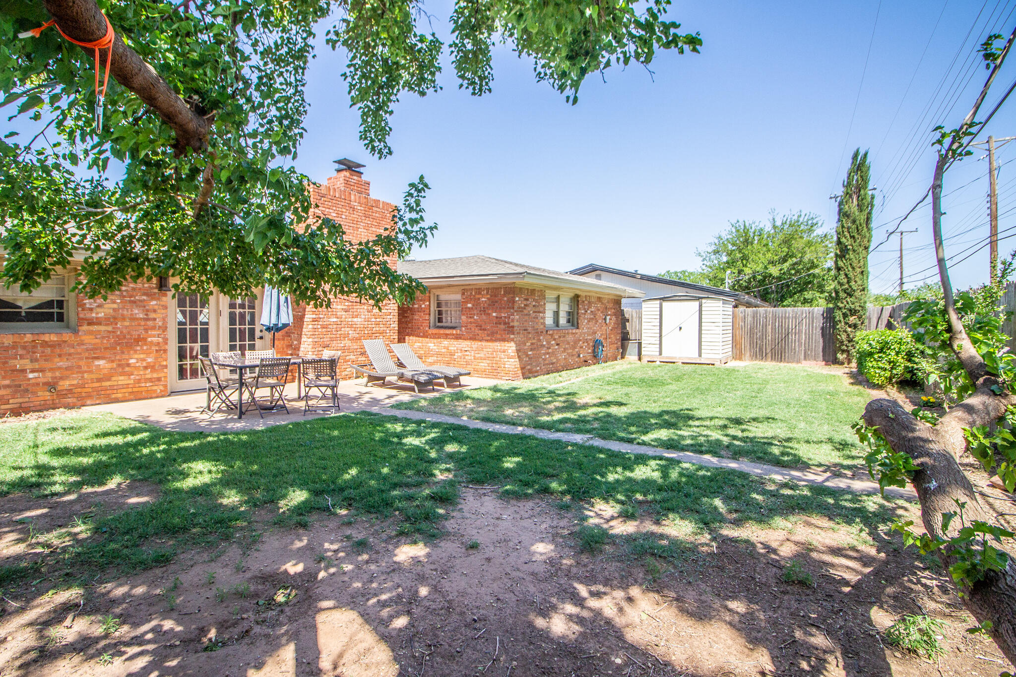 5219 9th Street Lubbock, TX 79416 - Photo 10 of 23 a view of a house with a yard