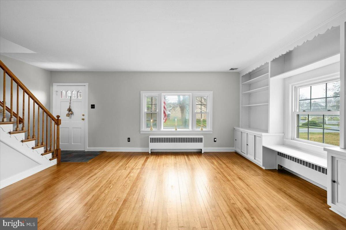 3349 Brodhead Road Bethlehem, PA 18020 - Photo 16 of 53 a view of an empty room with wooden floor and a window